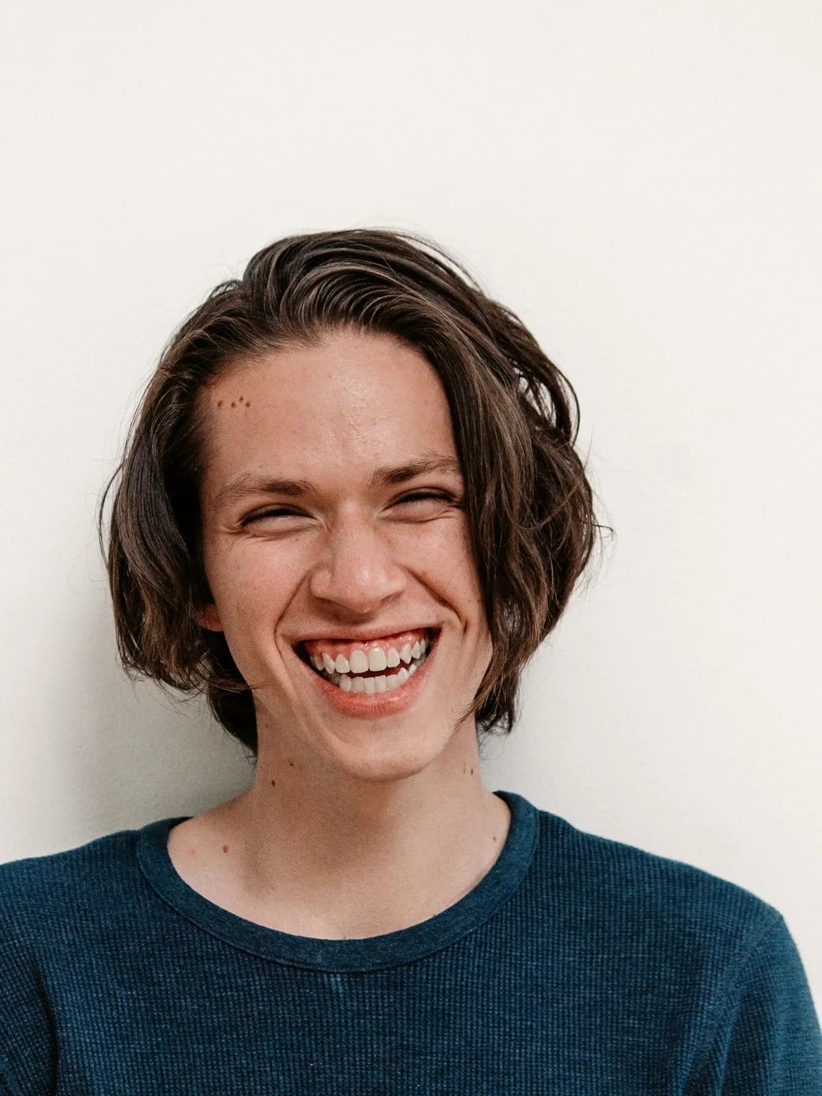 Portrait of a young man laughing